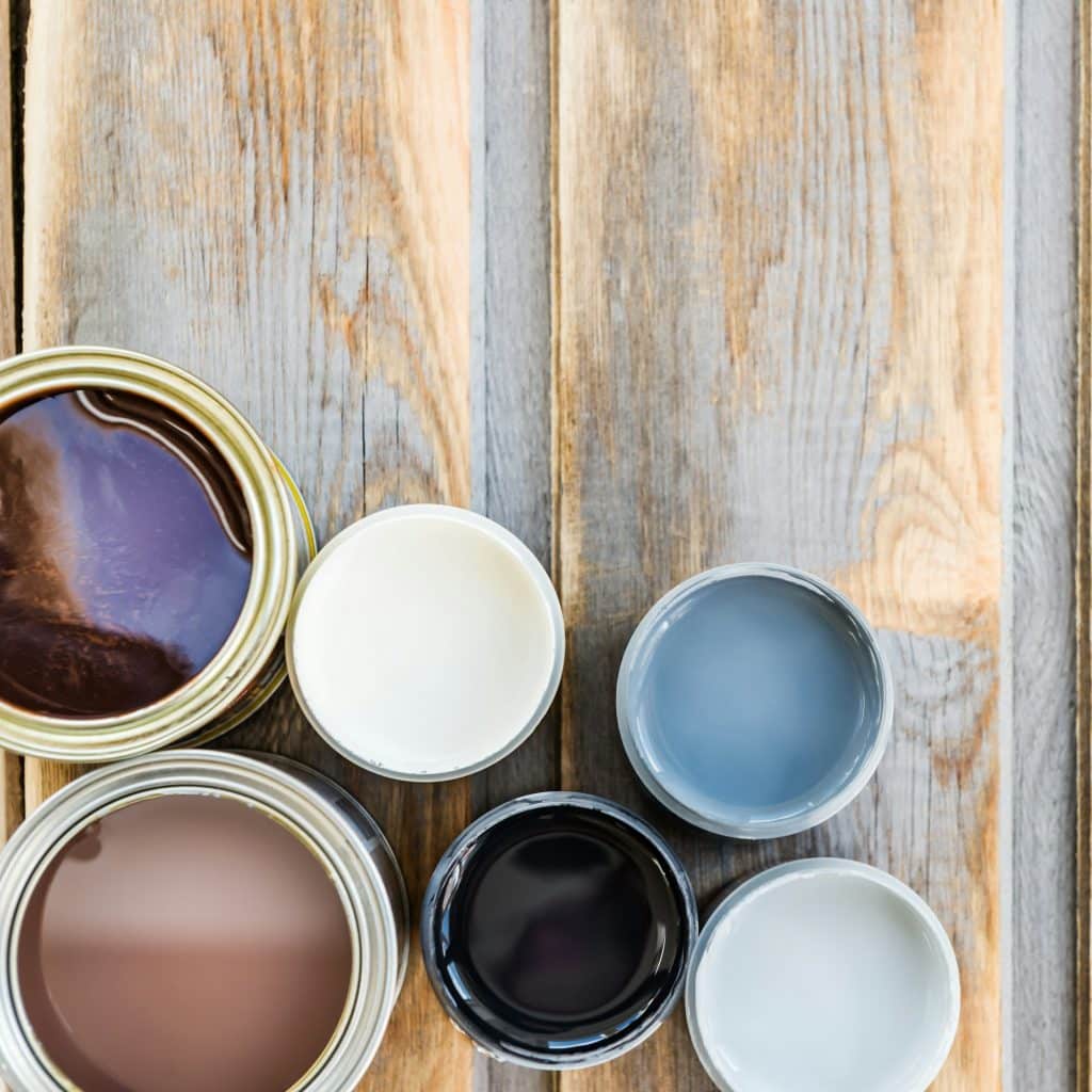 Open Cans of Different Paints, Varnish and Stain